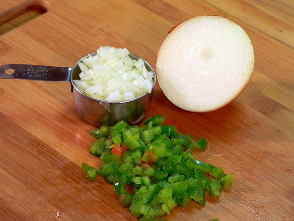 Chop your onions and bell pepper.