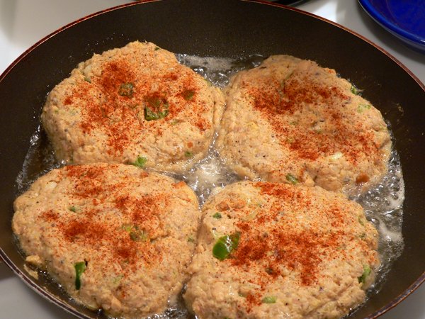 Fry the salmon patties until brown on both sides.